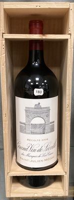 a bottle of wine sitting in a wooden box
