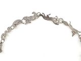 silver bracelet with animals and birds on a chain
