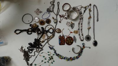 a table with a bunch of jewelry on it