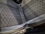 a seat in the back of a car with a seat belt down