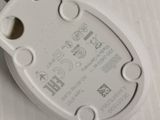 a close up of a white electronic device on a table