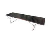 a black bench that is sitting on a white surface