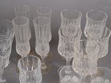 a lot of glasses that are sitting on a table