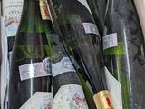 bottles of wine in a cardboard box on a table