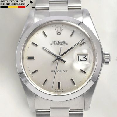 an image of a rolex watch with a white dial