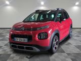 the red citrole is parked on a checkered floor
