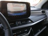 a picture of a car dashboard with a monitor in it