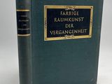un livre vert avec des bordures dorées et une couverture noire