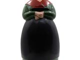 a figurine of a man sitting on top of a barrel