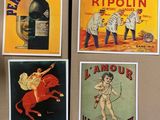 four posters of various types of alcohol on a refrigerator