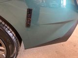 a close up of a car door with a sticker on it