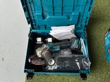 a blue tool box with tools in it on the floor