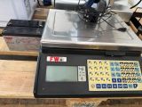a scale that is sitting on a wooden table