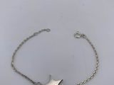 a silver bracelet with a star charm on it