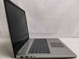 an open laptop computer sitting on top of a white surface