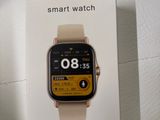 a box with a smart watch on it sitting on a table