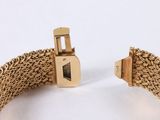 an image of a close up of a bracelet on a white surface