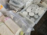 a lot of plastic containers and cups on the floor