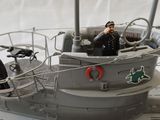 a model of a small boat with people on it