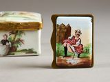 a small box with a picture of a man and a woman on it