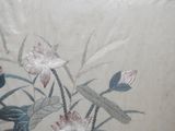 a picture of a painting of flowers on the wall