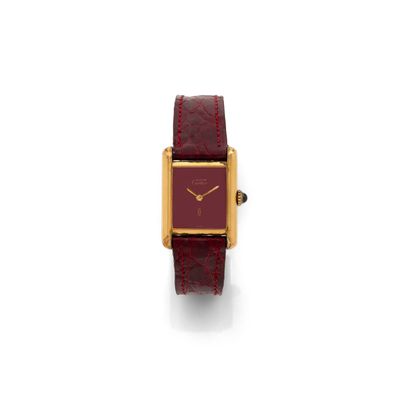 an image of a red and gold wrist watch with a square face