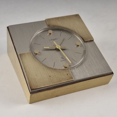a clock that is sitting in a box on a table