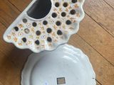 a white plate with a black and yellow design on it
