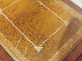 a close up of a table with a brown table cloth on it