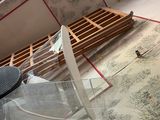 a glass table with a piece of furniture on it