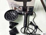a hair dryer and blow dryer sitting on a table