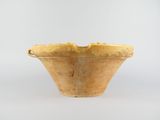 bowl made of yellow clay on a white surface with a white background