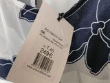 the back of a dress with a price tag on it