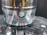 several jars of cbd cream sitting on top of each other