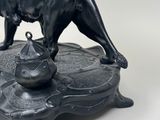 a statue of a lion standing on top of a table