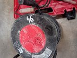 an image of a red tool box with a corded cord and a corded cord