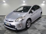 a picture of a silver toyota prius parked in a garage