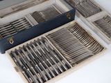 a lot of silverware in a box on a table