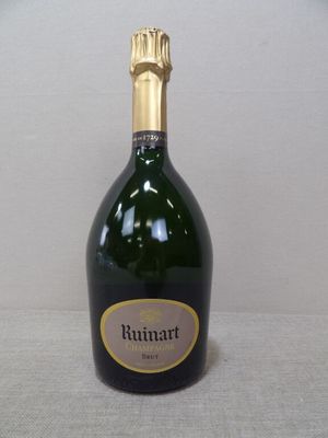 the bottle of wine is sitting on the table ready to be filled