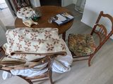 a picture of a dining room with a table and chairs