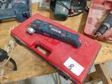 a red box with tools on a table in a workshop