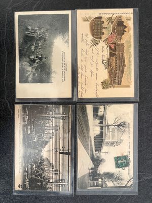 several old postcards of different styles and designs on a black surface