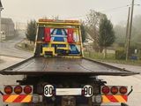 a flatbed truck with a flat bed on the back of it