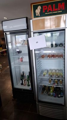 two refrigerators that have drinks in them in a store