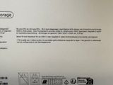 the back of a white box with a picture of a person holding a cell phone