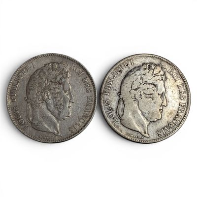 two silver coins with a man ' s face and a woman ' s head