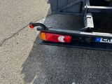 an image of a truck with a trailer attached to it ' s back