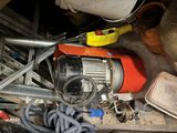 a pile of assorted items and tools on a table