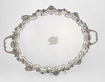 a silver tray with handles and handles on a white surface