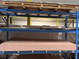 a large racking area with shelves and shelves in a warehouse